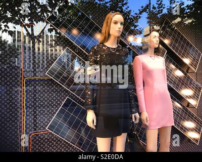 Two mannequins in a shop window. Stock Photo