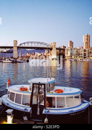 Vancouver False Creek at sunset with bridge and boat Stock Photo - Alamy