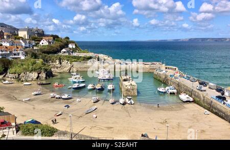 Fishing boats at low tide in Newquay Harbour, North Cornwall,England Stock Photo