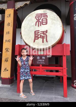 Xi’an drum tower ‘Frost’s descent the 18th solar term’ drum with little girl Stock Photo