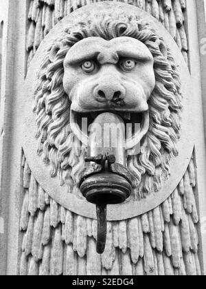 Water fountain in form of lions head , Bruges , Belgium Stock Photo