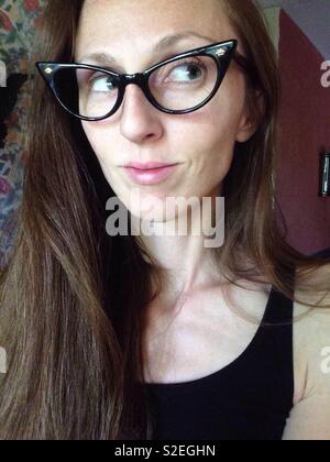 Woman wearing glasses, Cat eye glasses, retro glasses, vintage glasses Stock Photo