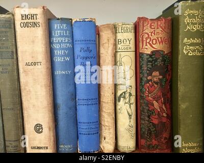 Old books on bookshelf Stock Photo