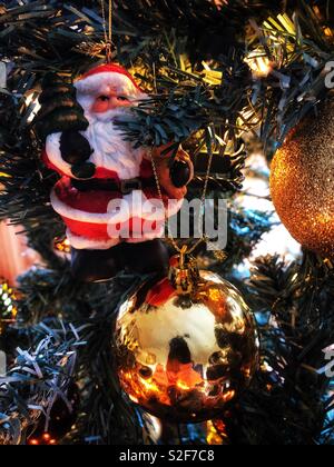 Christmas decorations hanging on a tree. Stock Photo