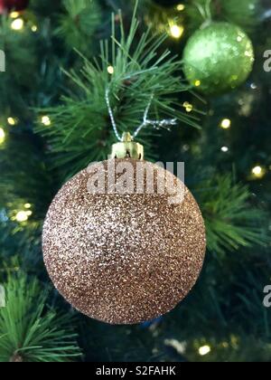Christmas decorations on Christmas tree in close up. Stock Photo