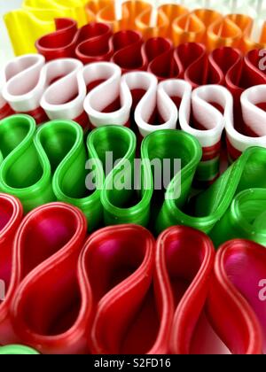 Brightly colored ribbon candy on a white background Stock Photo