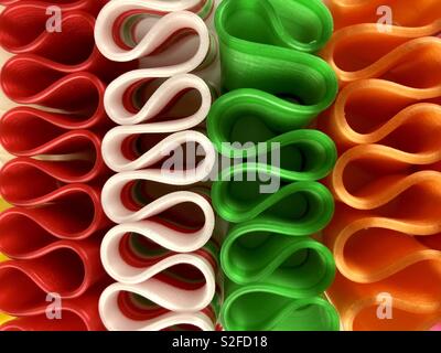 Brightly colored ribbon candy on a white background Stock Photo