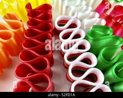 Brightly colored ribbon candy on a white background Stock Photo