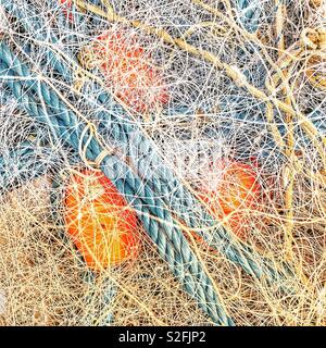 Fishing nets, ropes and floats in a boat Stock Photo