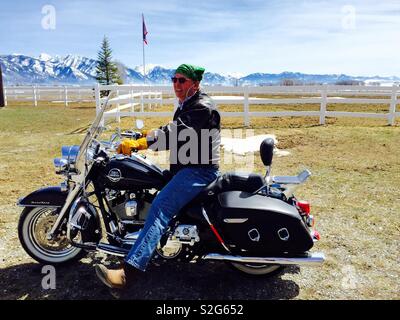 Man riding Harley Davidson motorcycle Stock Photo