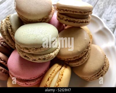 Pastel macarons on a white plate Stock Photo