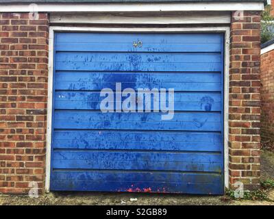 An old, blue garage door. Stock Photo
