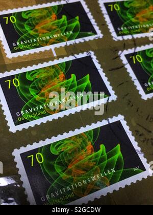 German Postage Stamps „Gravitationswellen“ on a Parcel - December 2018 Stock Photo
