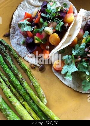 Veggie tacos and roasted asparagus Stock Photo