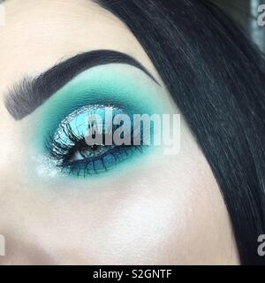 Close up turquoise blue eye makeup Stock Photo