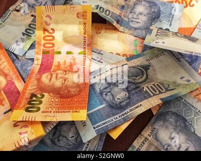 South African money - R100 and R200 notes with Nelson Mandela’s picture on them. Stock Photo