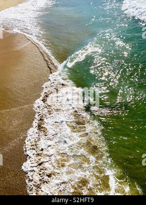 Overhead photo of a wave breaking on the shore. Manhattan Beach, California USA. Stock Photo