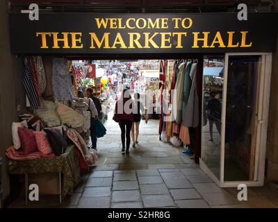 Entrance to the covered indoor market of Durham Market Hall at Durham city in the north of England. Inside are home, gift, fashion, beauty, hobby and many other items for sale. Stock Photo