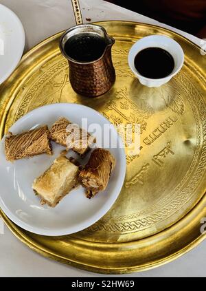 Traditional Arab coffee served with Baklawa- Traditional middle eastern pastry sweets. Stock Photo