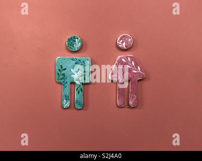 Public bathroom sign for woman and man Stock Photo