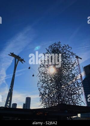 Quantum Cloud sculpture by Antony Gormley with the Emirates Air Line Cable Car in background. Greenwich, London by the River Thames and O2 Arena. Stock Photo