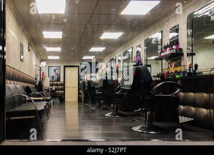 View through barbershop window. Glasgow. Scotland. UK. Stock Photo