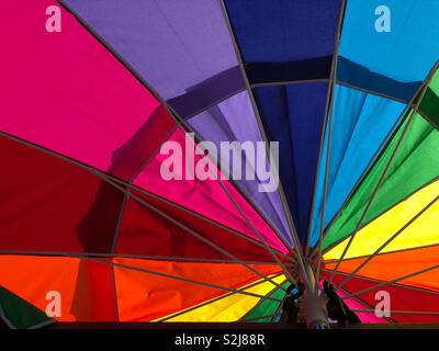 Rainbow beach umbrella closeup detail Stock Photo