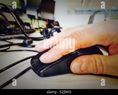Male hand using a computer mouse. Stock Photo