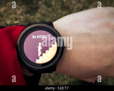 Goal reached notification on sports watch, floors climbed feature Stock Photo