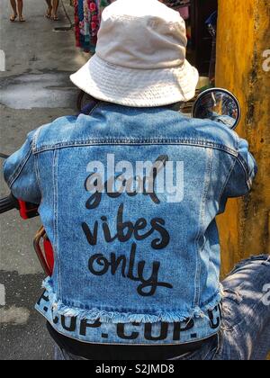 Good vibes only - motorcycle jeans jacket. Adia Stock Photo