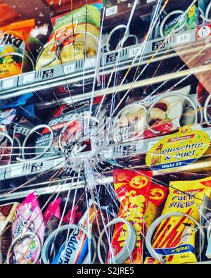 Snack vending machine with smashed glass Stock Photo