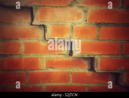 Zigzag crack in a brick wall Stock Photo