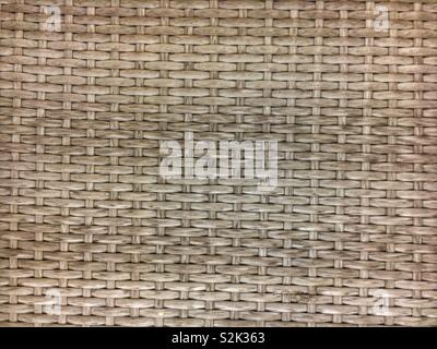 Full frame for a standard horizontal beige wicker basket weave. Stock Photo