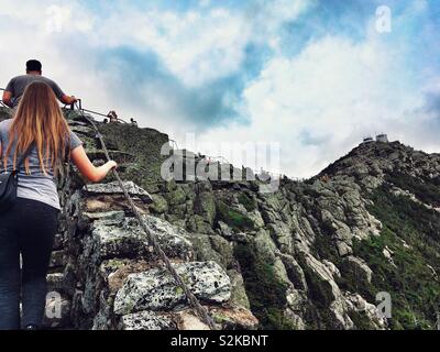 Tourists climbing Whiteface Mountain in the Adirondack mountains of NY, USA Stock Photo