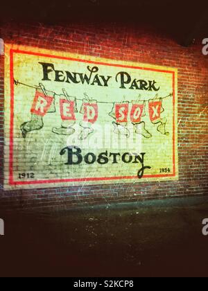 Distressed grunge image of Boston Red Sox sign that is painted on red brick wall at Fenway Park Stock Photo