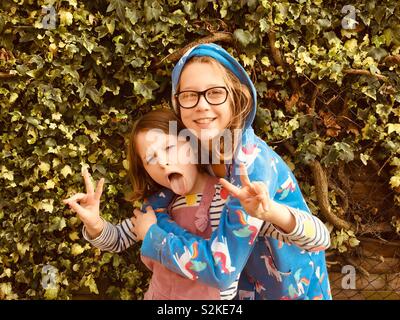 Two sisters posing for pictures Stock Photo