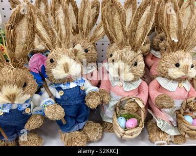 Funny bunny dolls on display on shop shelter ready to be purchased for the Easter. Stock Photo