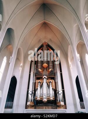 Looking at the pipe organ inside a Lutheran church called Hallgrímskirkja. It is located in Reykjavík Iceland. Stock Photo