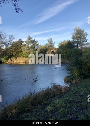 View of the cascade across Eleven Acre Lake at Stowe Gardens, Buckinghamshire. National Trust Stock Photo