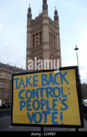 Brexit sign outside the Houses of Parliament in Westminster, London. Placed by a remainder stating, “Take back control: People’s vote!” Stock Photo
