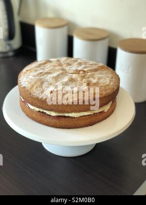 Victoria sponge cake on stand home baked Stock Photo