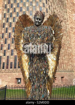 Knife Angel sculpture outside Coventry Cathedral. Designed by Alfie Bailey as a monument against violence and aggression. It standing at 27ft 8m tall it is made from 100,000 blades handed into police Stock Photo