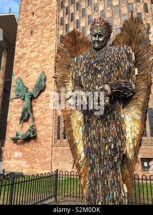 Knife Angel sculpture outside Coventry Cathedral. Designed by Alfie Bailey as a monument against violence and aggression. It standing at 27ft 8m tall it is made from 100,000 blades handed into police Stock Photo