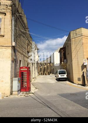 British Telephone Box in Street on Mediterranean Island of Gozo. Stock Photo