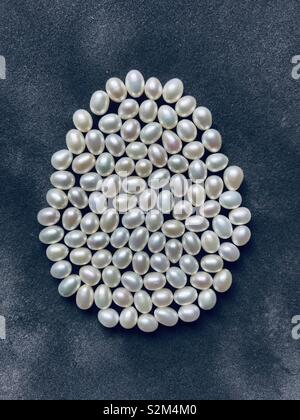 Pearl Easter Egg. White and loose freshwater pearls Stock Photo