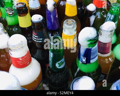 Lots of opened bottles of beer Stock Photo