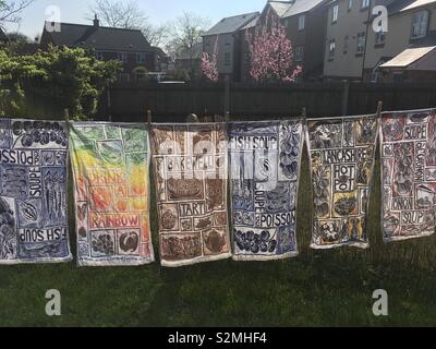 Tea towels on a washing line in the sun Stock Photo