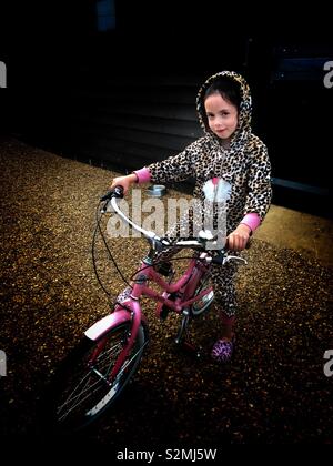 Girl riding her new bicycle Stock Photo
