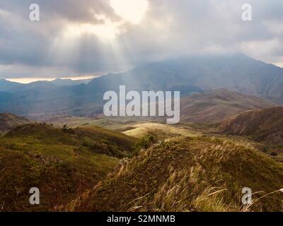 Sun rays over Mt. Iglit-Baco in San Jose, Mindoro, Philippines. Stock Photo
