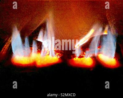 Colorful Gas flames in fireplace Stock Photo